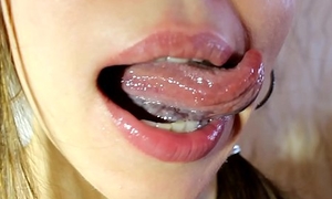 Good-luck piece tongue Ananta Shakti licking thumbs